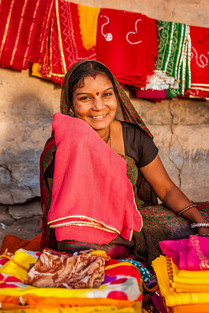 istock Indian woman selling colorful fabrics 531553340