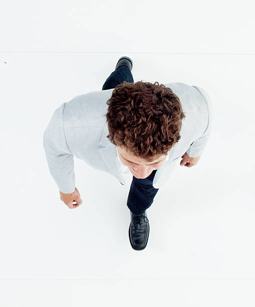 istock Above view of smart casual man walking 531555418