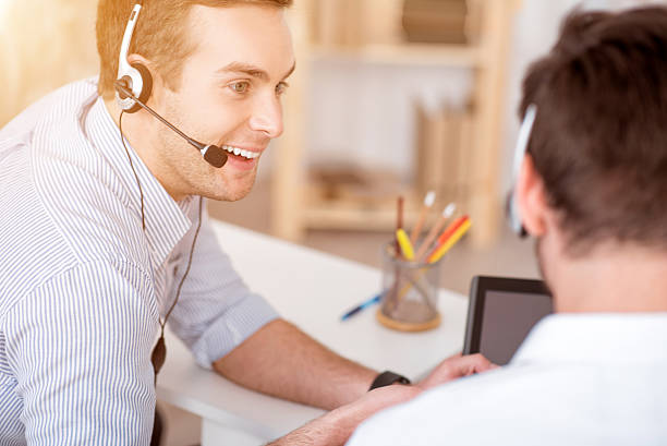 istock Pleasant man working with his colleague 531556850