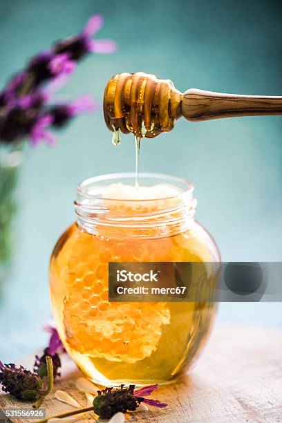 Honey Dripping To Jar With Vax Comb Stock Photo - Download Image Now - Beeswax, Drop, Food