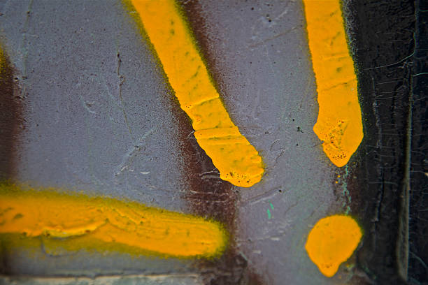 istock yellow graffiti abstract paint background pattern city concrete wall 531559294