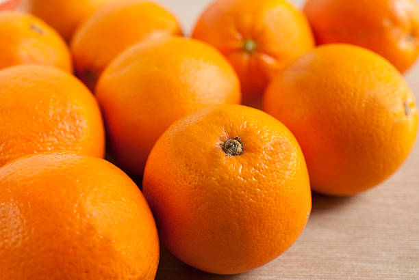 istock oranges on wooden background. 531559356