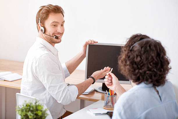 istock Delighted smiling colleagues working in the office 531560398
