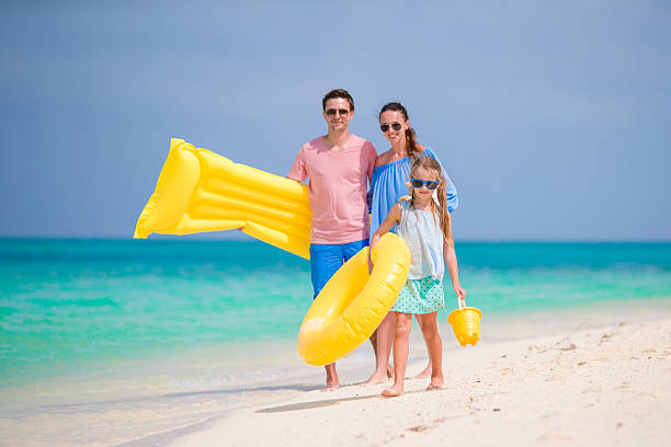 istock Young family enjoy beach vacation 531560948