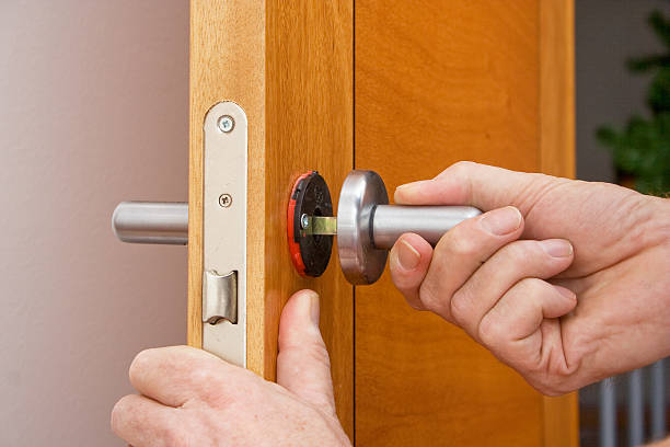 istock Handyman repairing a door handle 531562046