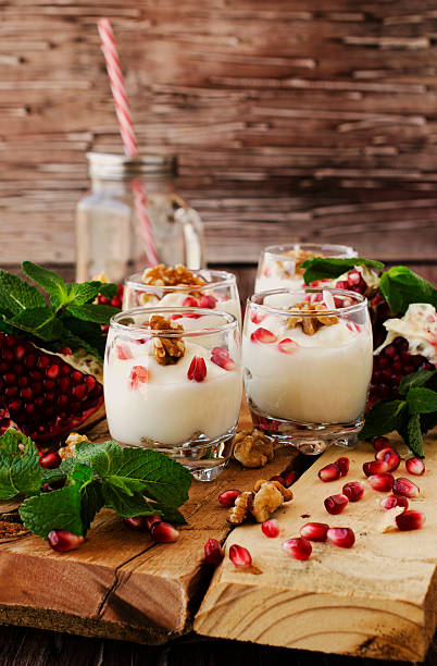 istock yogurt dessert with walnuts and pomegranate selective focus 531562248