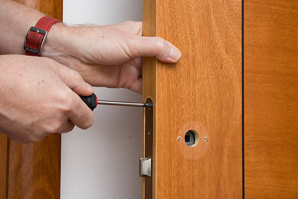 istock Handyman repairing a door handle 531562470