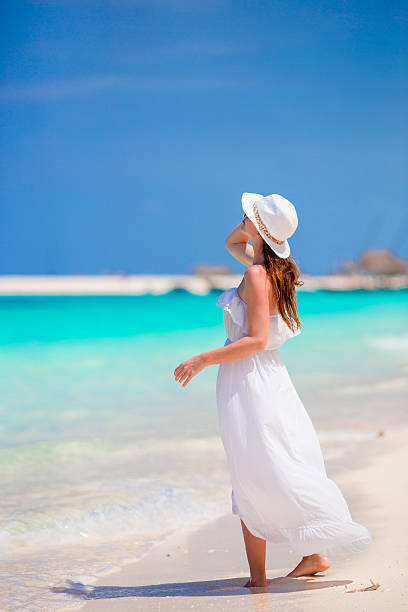 istock Young beautiful woman on beach vacation 531563112