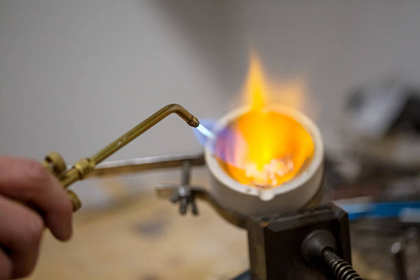istock Blowtorch forging soft metals into jewelry. 531563138