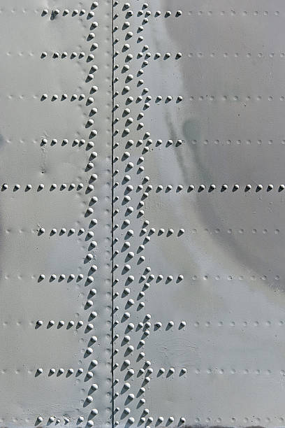 istock grunge background metal texture with screws 531563250
