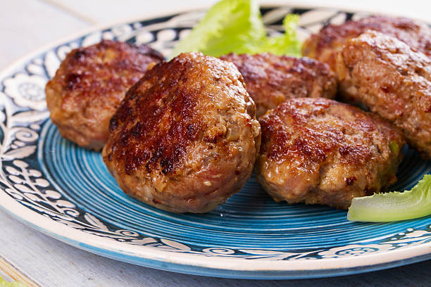 istock Beef and Pork Patties in Blue Plate 531565886