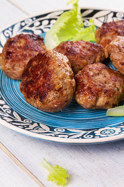 istock Beef and Pork Patties in Blue Plate 531565934