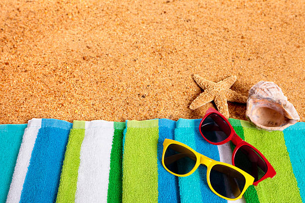istock Tropical summer beach background, sunglasses, couple sunbathing 531566236