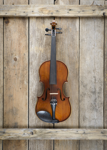 Fiddle violin on weathered barn wood