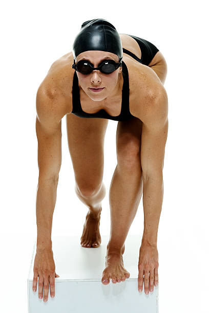 Female swimmer about to dive
