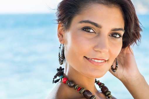 Portrait Of Happy Attractive Young Woman With Jewelry