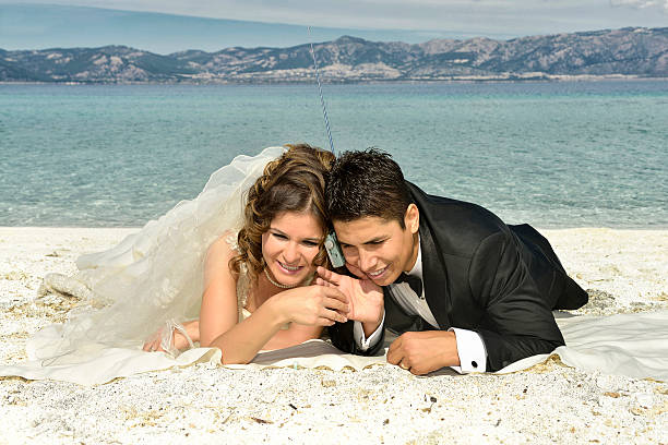 istock Bride and groom on the beach 531570165