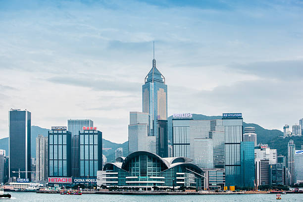 Hong Kong Skyline Hong Kong Skyline with Convention and Exhibition Centre and Central Plaza in the center. central plaza hong kong stock pictures, royalty-free photos & images