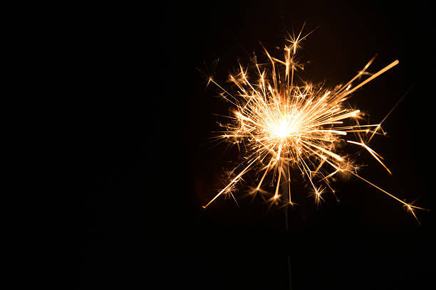istock New year party sparkler on black background 531571273