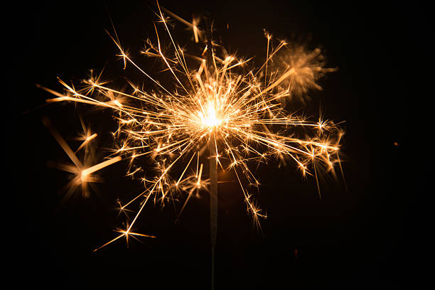istock New year party sparkler on black background 531571277