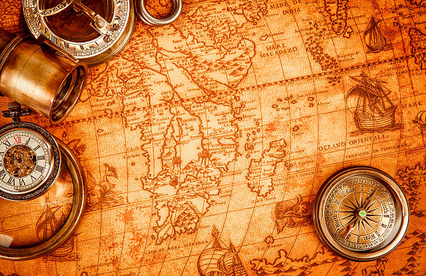 istock Vintage magnifying glass lies on an ancient world map 531572555