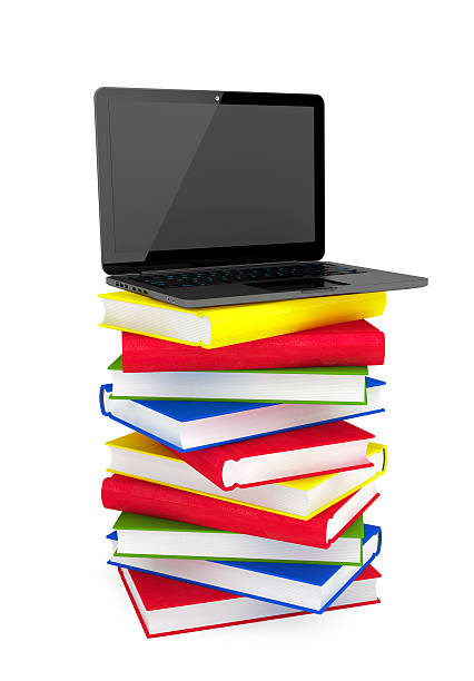 istock E-learning concept. Laptop on top of stack of colorful books 531579251