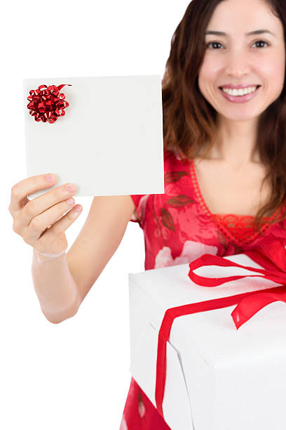 istock Gift card woman holding a present 531579885