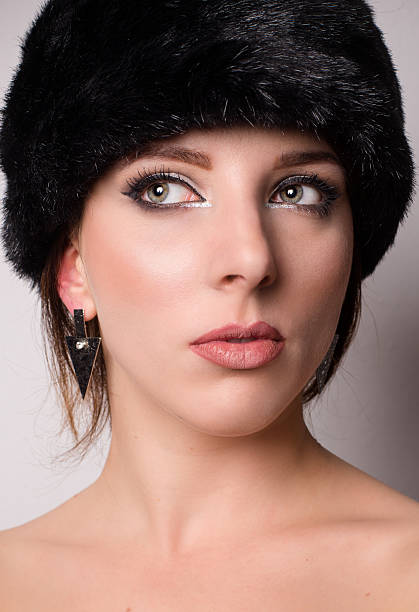 istock Attractive pensive young woman in a winter hat 531580129