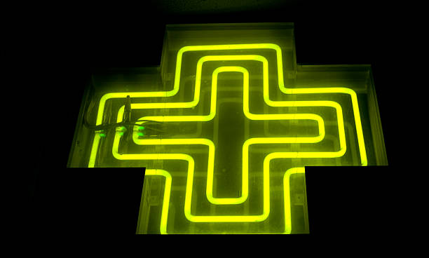 istock Pharmacy neon green cross 531582981