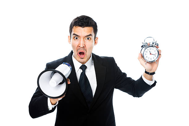 istock man with megaphone and alarm clock 531595119