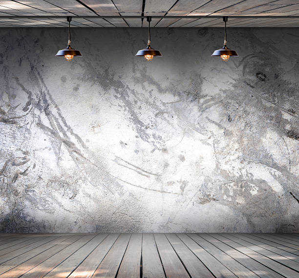 istock Lamp at Grungy concrete wall with wood floor 531597251