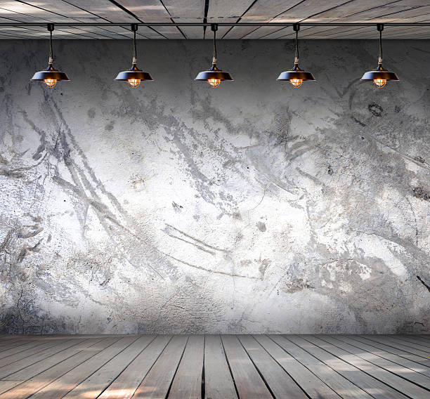 istock Lamp at Grungy concrete wall with wood floor 531597253