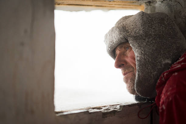istock Man Looking  through Great War's Bunker Porthole , Snowing, Alps, Europe 531598235