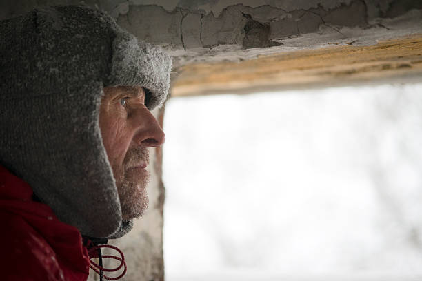 istock Man Looking  through Great War's Bunker Porthole , Snowing, Alps, Europe 531598329