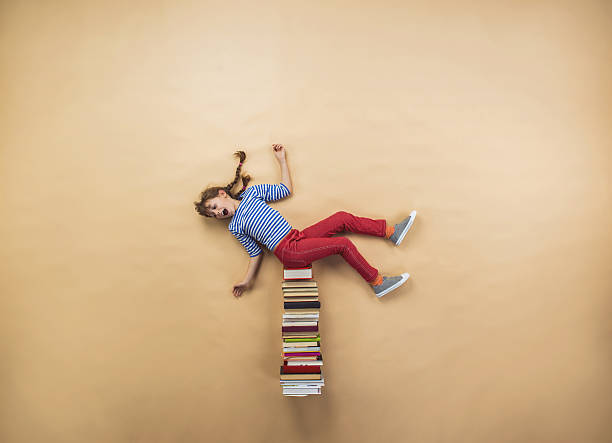 istock Girl with books 531599859