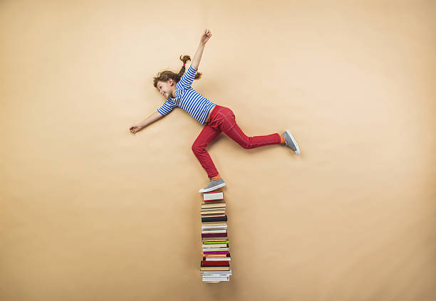 istock Girl with books 531599861