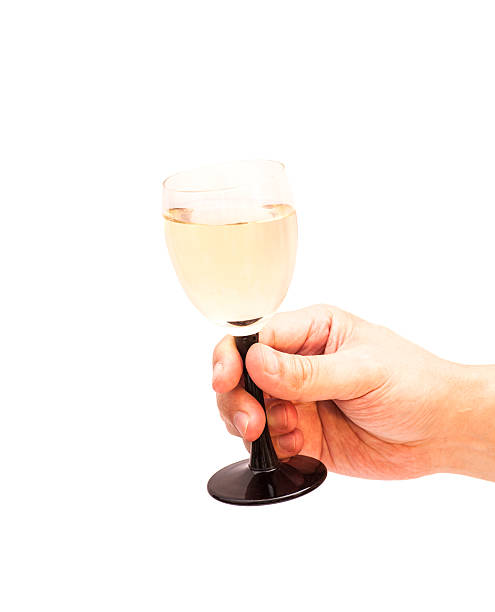 istock Hand holds glass goblet with champagne 531600257