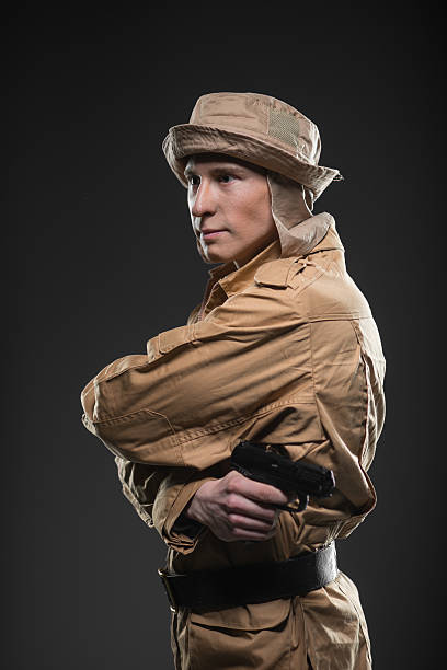istock Soldier with a gun on dark background 531603222