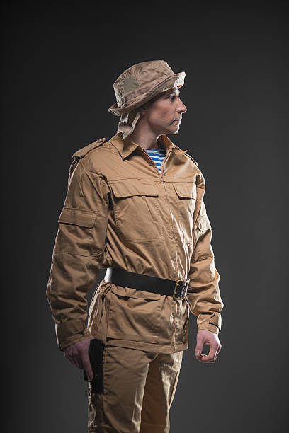 istock Soldier with a gun on dark background 531603328