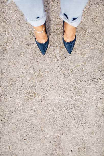 istock High angle view woman looking high heels shoes 531603942