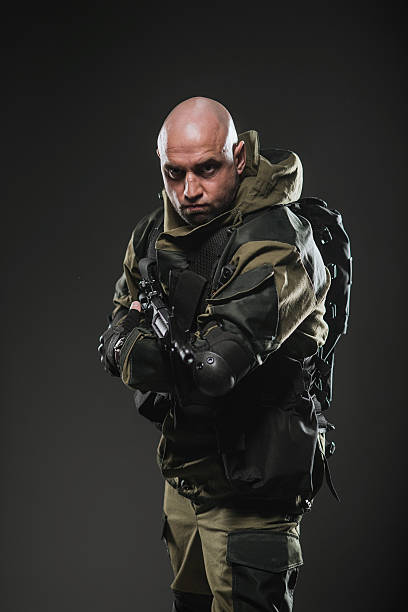 istock soldier man hold Machine gun on a  dark background 531604874