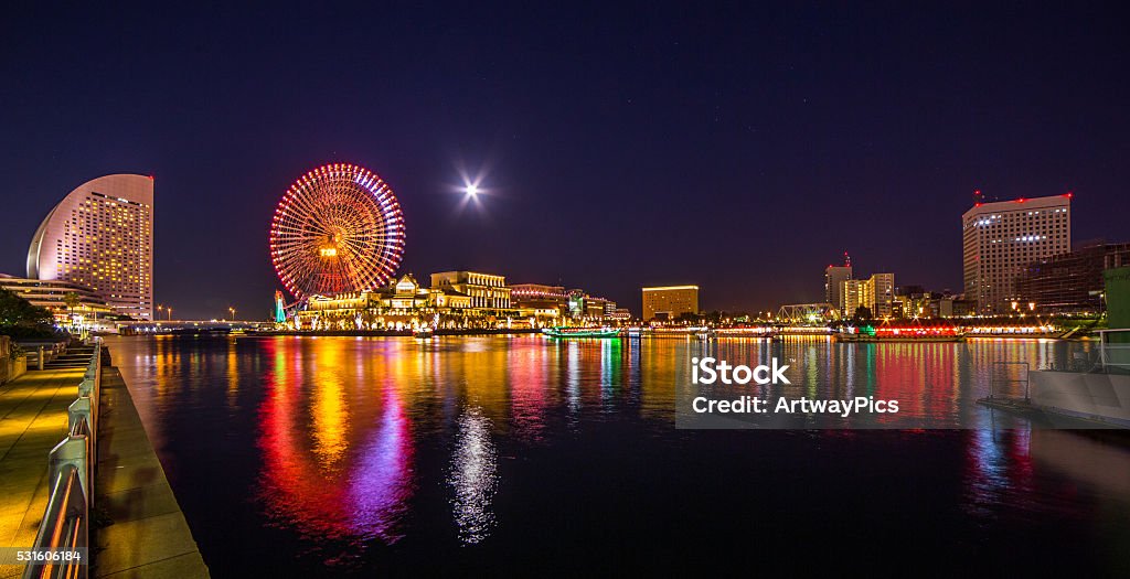 Japan Yokohama at starry night with full moon Colourful Yokohama at strarry night with full moon, facing north with Minato Mirai complex Queens Square and Cosmo Clock 21. Capital Cities Stock Photo