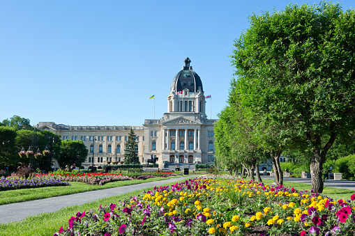 The Saskatchewan Legislative Building was designed by Edward and W.S. Maxwell of Montreal, Quebec who described their design as a free adaptation of English Renaissance architecture which marks it unmistakably as a representative of the British Sovereignty under which the province is governed. Construction began on August 31, 1908, and the building was officially opened on October 12, 1912 by His Royal Highness the Duke of Connaught, who was Governor General of Canada and a son of Queen Victoria. The Saskatchewan Legislative Building is 167 metres long and 94 meters wide from the north to south wings, and 56 metres high from ground level to the top of the dome.