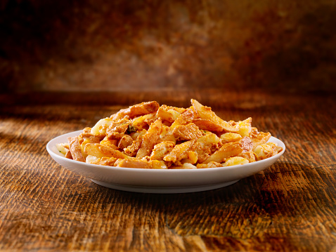 Hand Cut French Fries with Cheese Curds and Butter Chicken - Photographed on Hasselblad H3D2-39mb Camera
