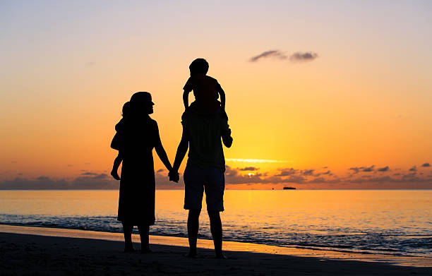 istock happy family with two kids having fun at sunset 531608228