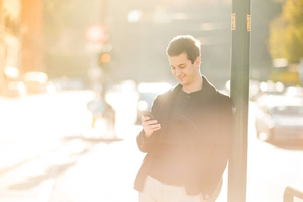 istock Young businessman using a smartphone on the street 531608419