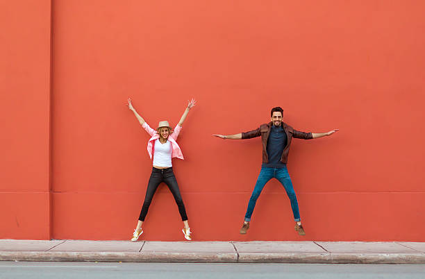 istock Young couple jumping for fun 531608592