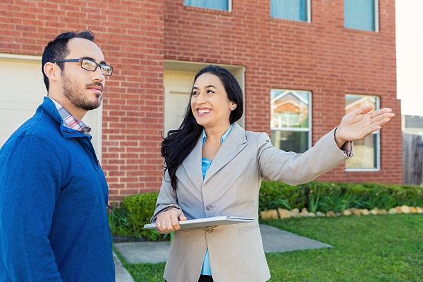 istock Real Estate Agent discusses home with potential client 531608810