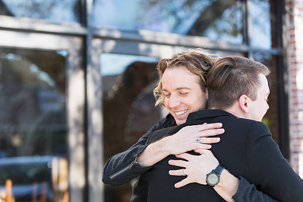 istock Two homosexual men embracing outdoors 531609136