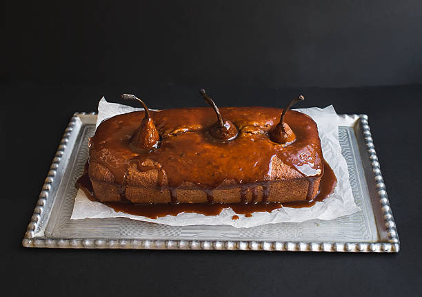 istock Spicy pear cake with caramel topping on a silver dish 531609685
